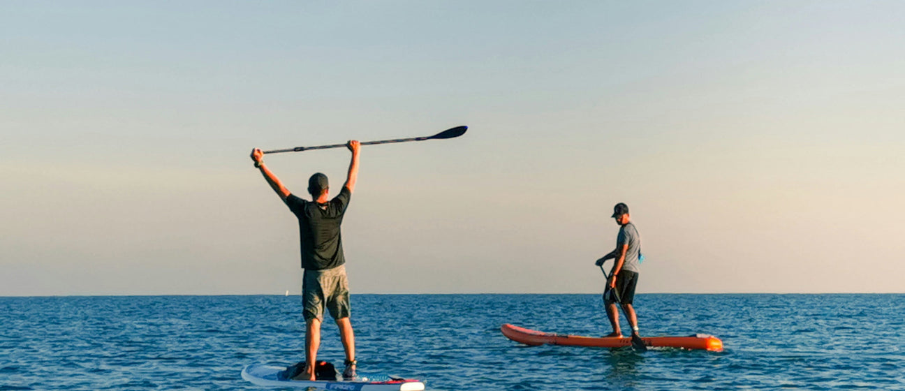 paddle boarders on a lake