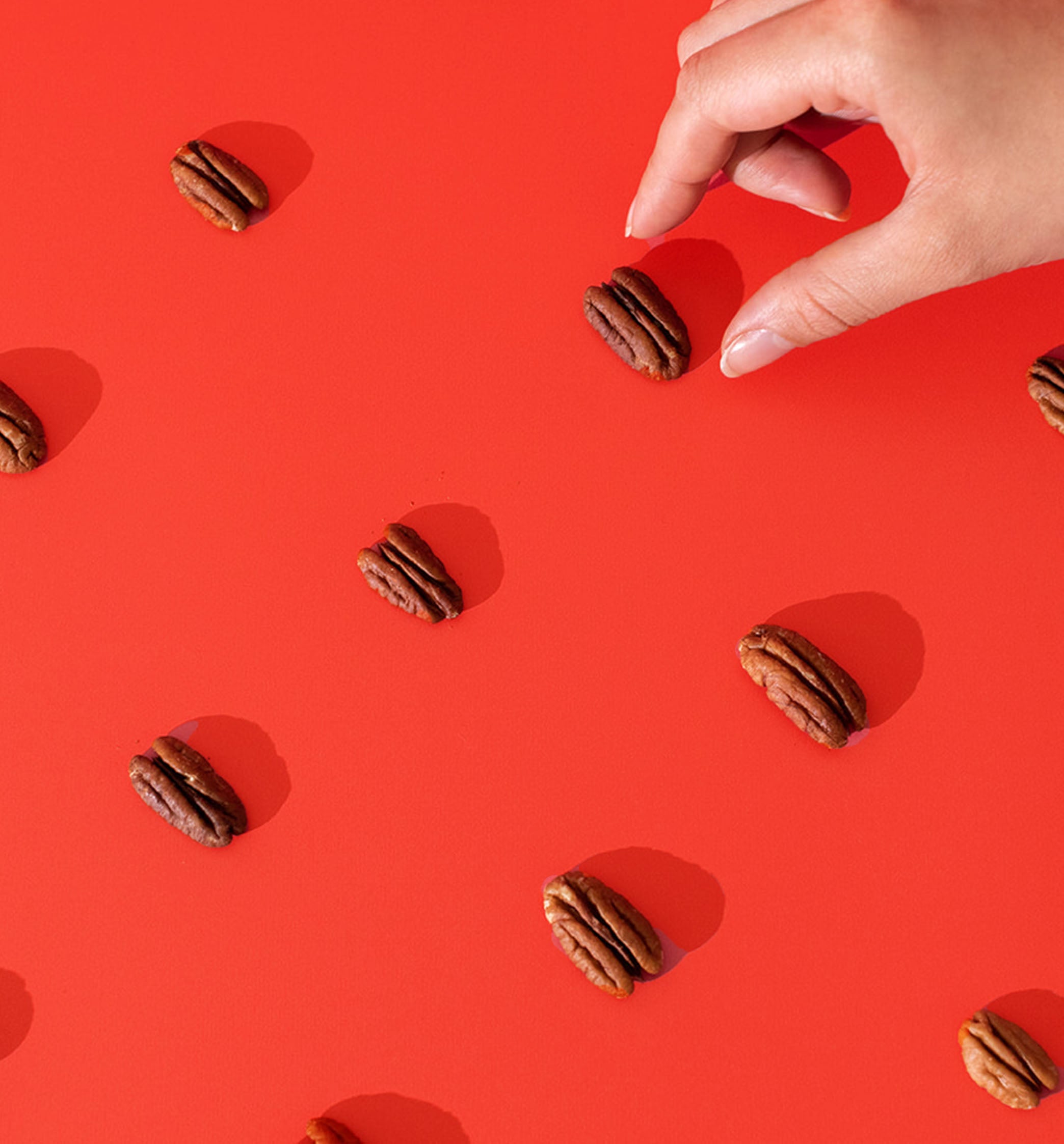 pecans on red background