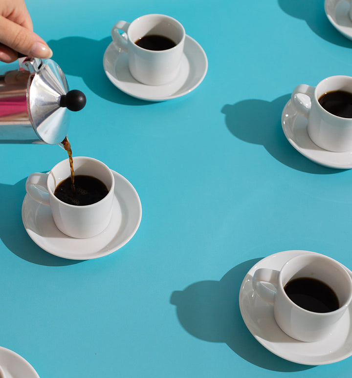 espresso cups on a blue background