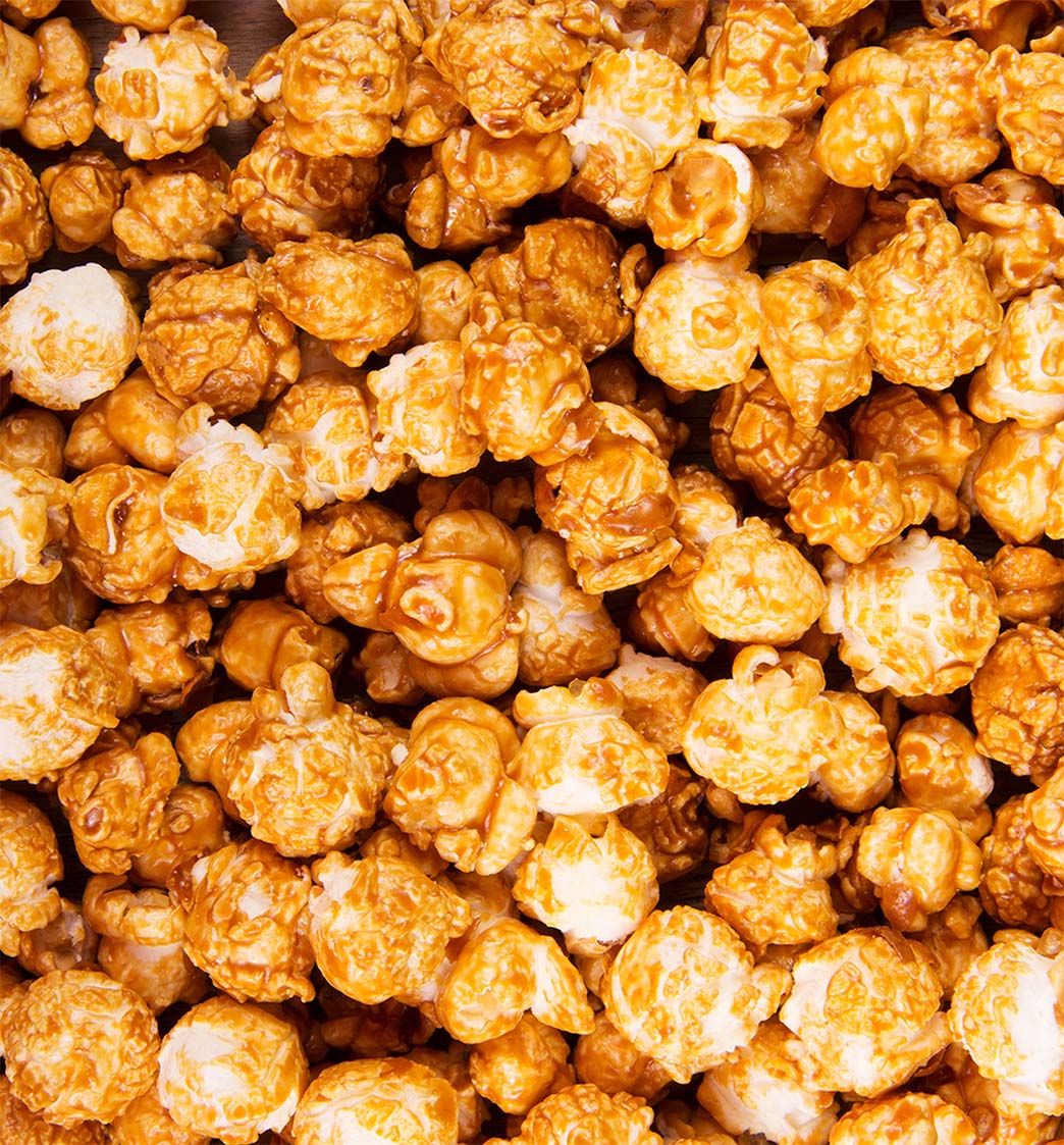 Close-up of caramel popcorn with a warm color palette.