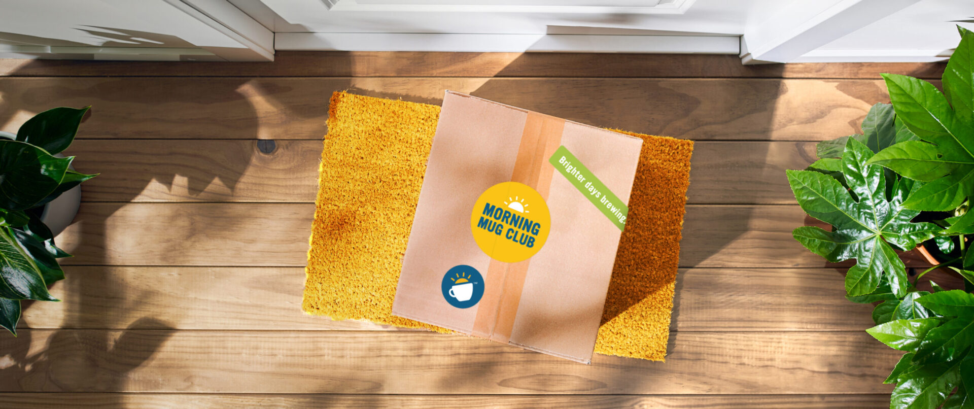 Morning mug club box on front steps