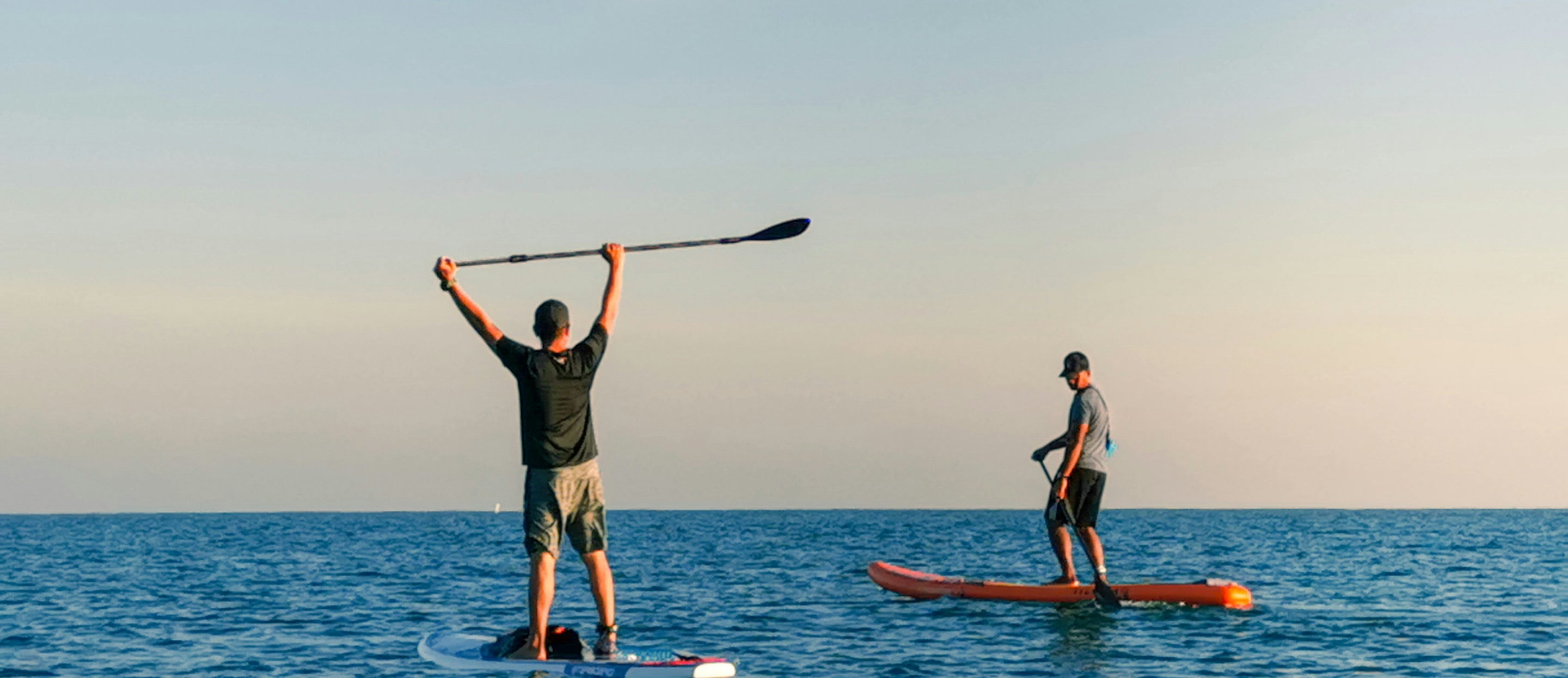 paddle boarders on a lake