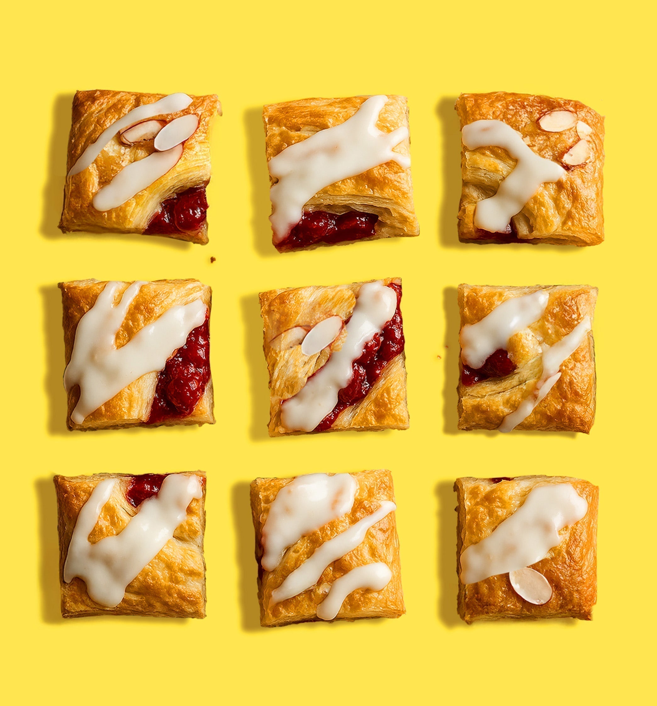 grid of raspberry almond kringle cut in squares