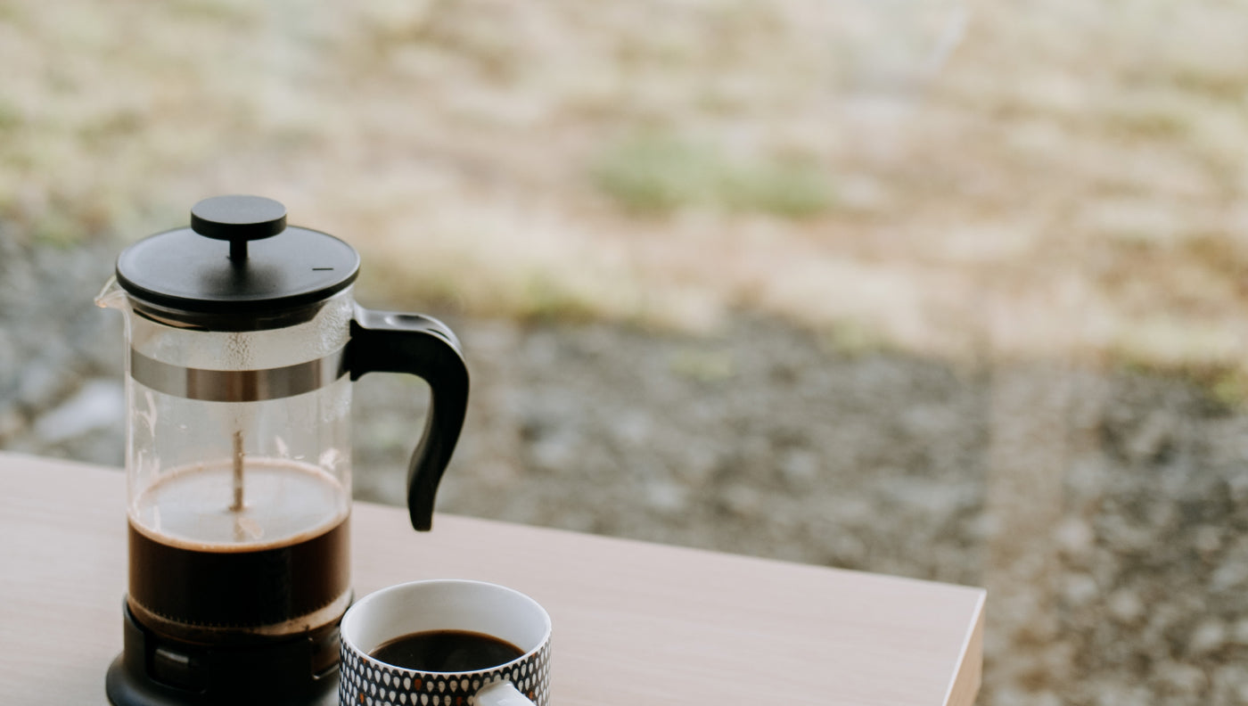 french press next to a window