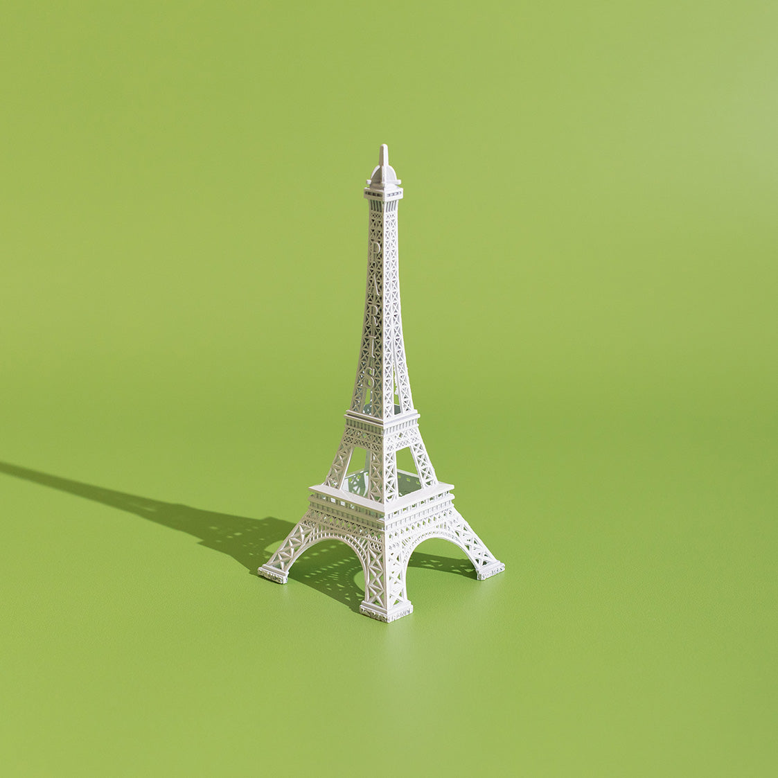 Eiffel tower on green background