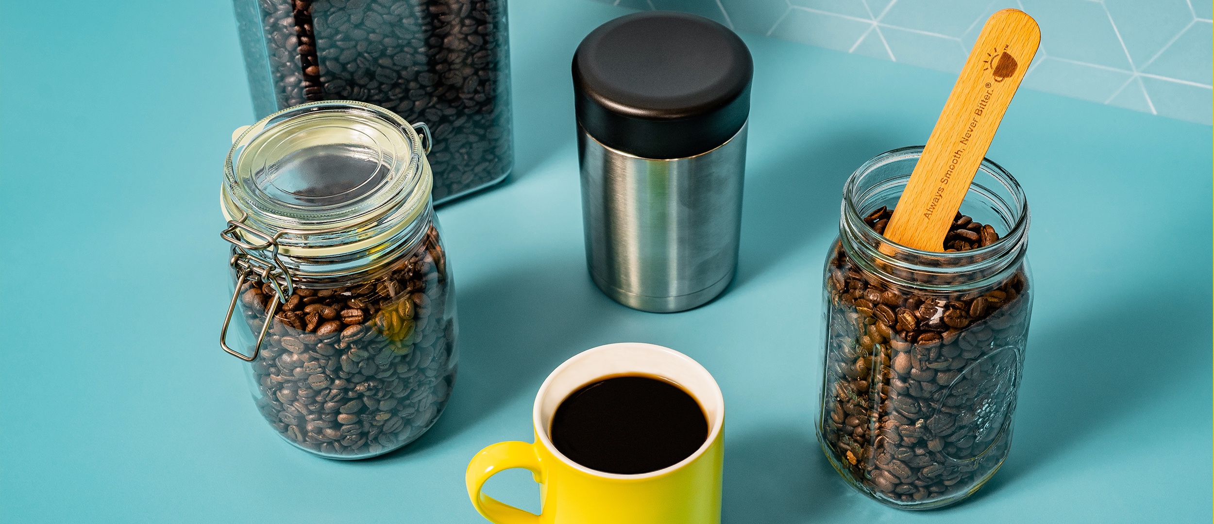 various coffee containers on a blue background