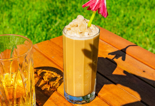image of a slushie drink with a pink umbrella straw