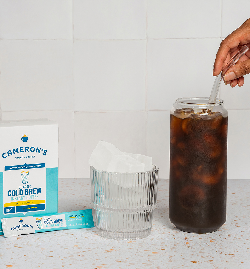 Camerons-ColdBrewSticks-glass Cameron's Coffee cold brew instant sticks, stirring coffee in a glass with ice